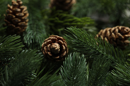 Branches of artificial Christmas tree with pine cones, macro viewの写真素材