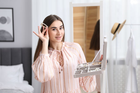 Woman with different accessories wearing hair clip indoorsの写真素材