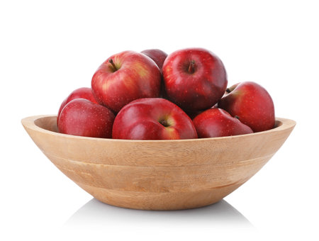 Fresh red apples in bowl isolated on whiteの写真素材