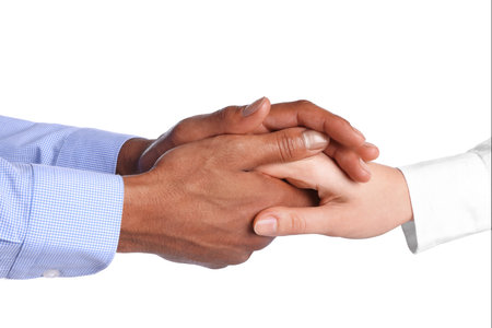 Man holding hands with woman on white background, closeupの写真素材