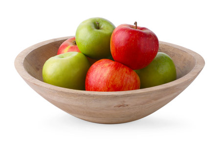 Red and green ripe apples in bowl isolated on whiteの写真素材
