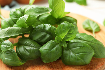 Fresh basil leaves on wooden table, closeupの写真素材