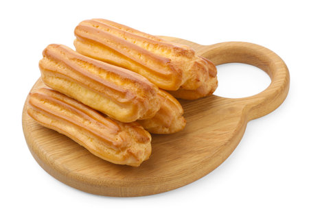 Tasty eclairs isolated on white. Delicious dessert