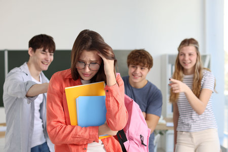 Students interacting with their classmate in classroom, selective focusの写真素材