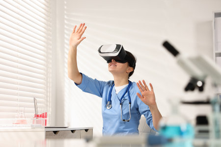 Modern technology. Doctor with headset using virtual screen in officeの写真素材