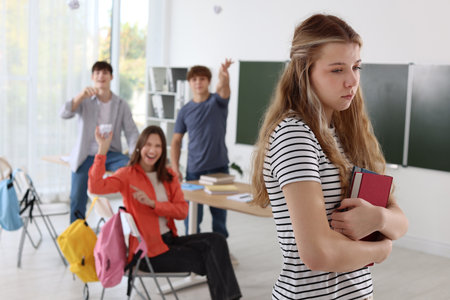 Students bullying their classmate in classroom, selective focusの写真素材