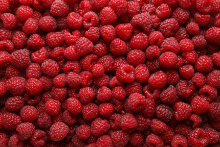 Fresh ripe raspberries as background, top view