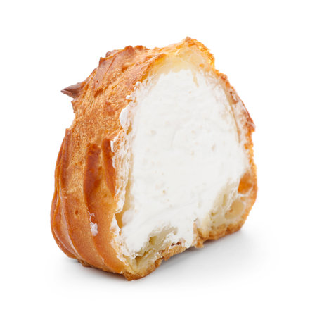 Half of tasty profiterole with whipped cream isolated on white