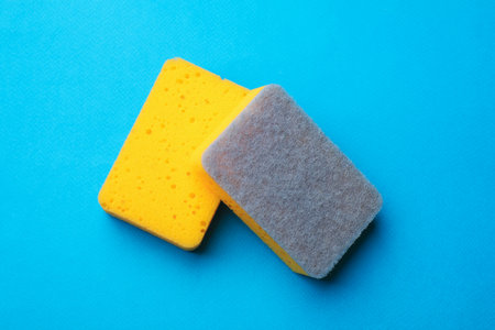 Kitchen sponges on light blue background, top viewの写真素材