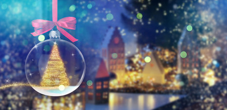 Merry Christmas and Happy Holidays greeting card with festive ball and bokeh lightsの写真素材