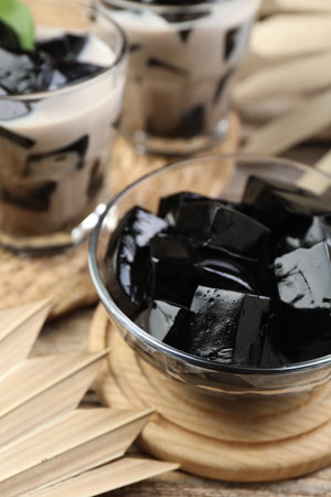 Tasty herbal jelly with milk and mint served on wooden table, closeupの写真素材