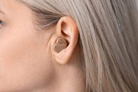 Closeup view of woman with hearing aid