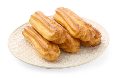 Tasty eclairs isolated on white. Delicious dessert