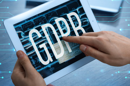 Man using tablet computer with GDPR on display, closeup. Privacy security