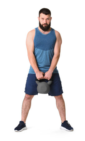 Man exercising with kettlebell on white backgroundの写真素材