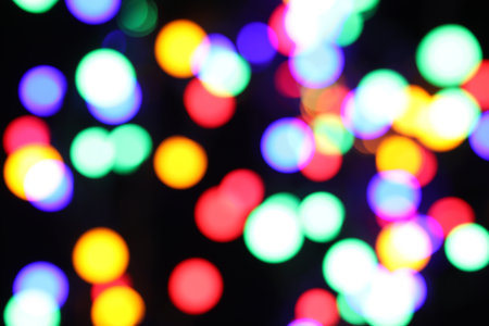 Blurred view of bright lights on dark background, bokeh effectの写真素材