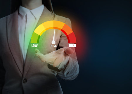 Woman holding virtual scale of risk against dark background, closeupの写真素材