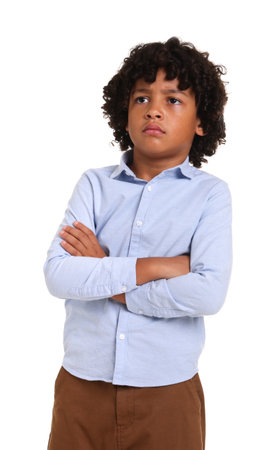Portrait of little boy with crossed arms on white background