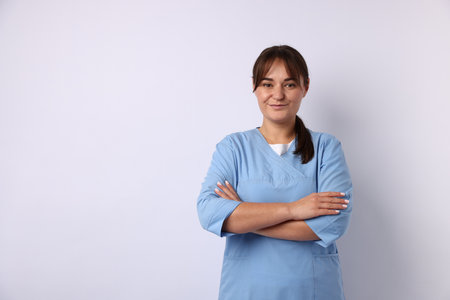 Doctor in medical uniform on white background, space for textの写真素材