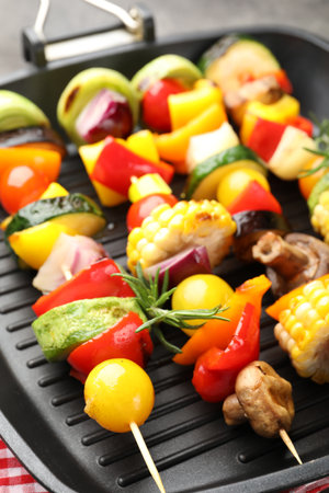 Grill pan with tasty vegetables on gray table, closeupの写真素材