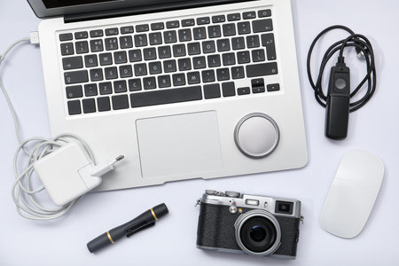 Professional photographer's equipment on white background, flat layの写真素材