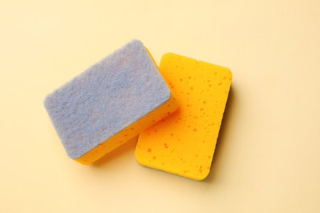 Kitchen sponges on beige background, top viewの写真素材