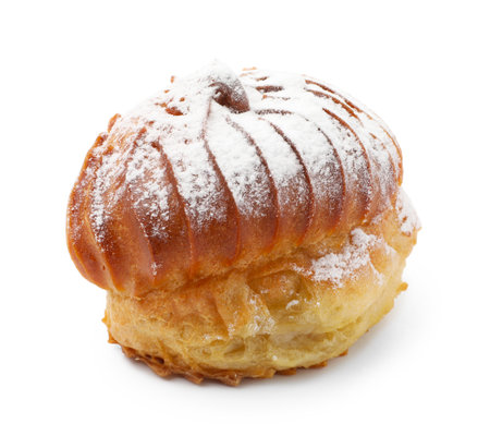 Tasty profiterole with powdered sugar isolated on whiteの写真素材