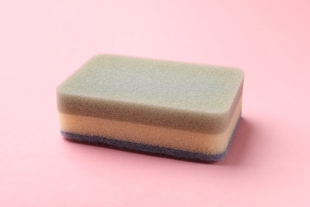 One colorful kitchen sponge on pink background, closeupの写真素材