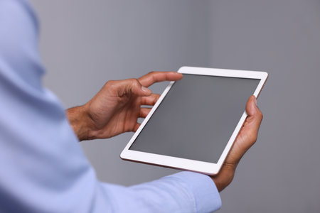African-American man using tablet in office, closeupの写真素材