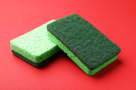 Clean kitchen sponges on red background, closeupの写真素材