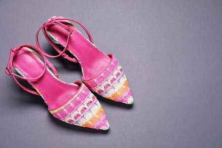 Pair of stylish shoes on gray background, flat lay. Space for text