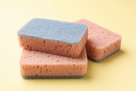 Clean kitchen sponges on beige background, closeup