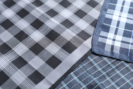 Different stylish fabric handkerchiefs as background, closeup