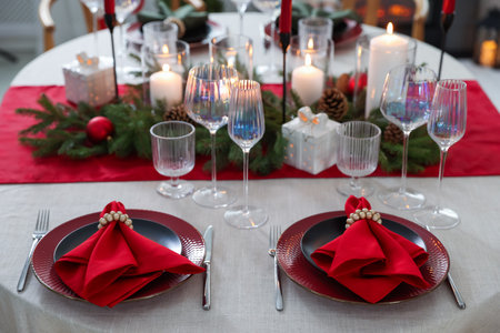 Festive table setting with Christmas decor indoors, closeup
