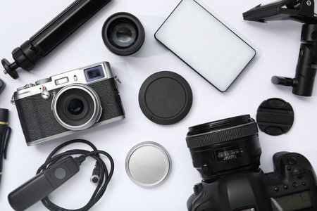 Professional photographer's equipment on white background, flat layの写真素材