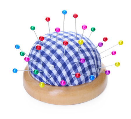 Checkered pincushion with pins isolated on white. Sewing accessoryの写真素材