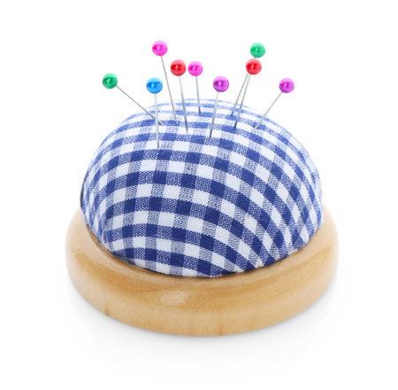 Checkered pincushion with pins isolated on white. Sewing accessoryの写真素材