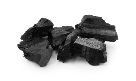 Pieces of black coal on white backgroundの写真素材