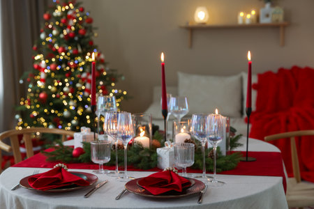 Festive table setting with Christmas decor indoorsの写真素材