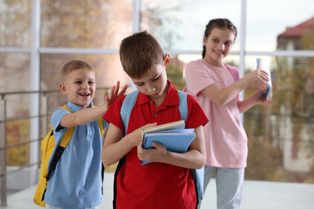 Boy getting bullied by his classmates in school, selective focusの写真素材