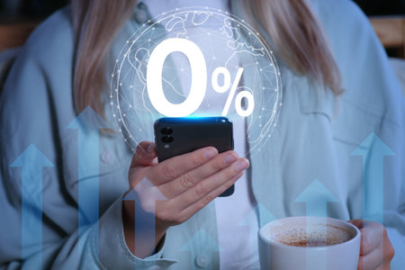 Woman using mobile phone indoors, closeup.の写真素材