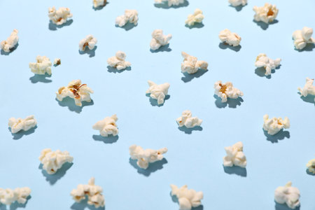 Tasty popcorn on light blue background, closeupの写真素材