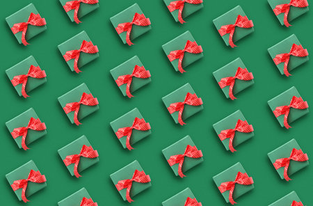 Christmas gift boxes on green background. Festive pattern designの写真素材