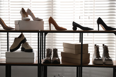 Shoe storage with different footwear in storeの写真素材