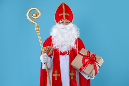 Saint Nicholas with gift and crozier on blue backgroundの写真素材