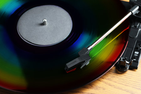 Vinyl record player with disc in rainbow colors, closeup viewの写真素材