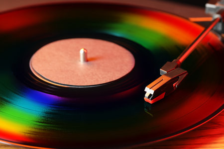 Vinyl record player with disc in rainbow colors, closeup viewの写真素材