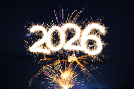 Merry Christmas and Happy New Year card with fireworks and sparkling numbers 2026の写真素材