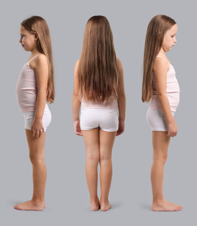Little girl in underwear on gray background. Set of portraits, view from different sidesの写真素材