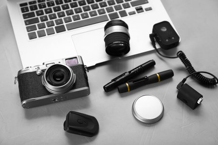 Different professional photographer's equipment on light backgroundの写真素材